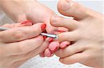 body care series. pedicure applying - toe nails cleaning and moisturizing with special solution.
