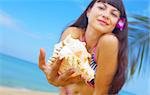 portrait of a young gorgeous female in tropical environment