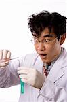 Crazy asian scientist with test tube in white bacground.