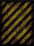 old grungy yellow hazard stripes on black road