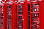 Four classic London telephone cabins. London symbol