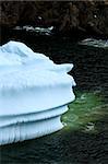 A close view of a massive iceberg stuck in a small bay off the coast of Newfounland, Canada.