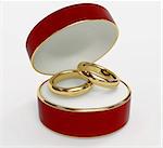 Red 3d casket with two wedding rings. Object over white