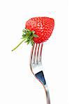 Close-up of a strawberry and a fork isolated on a white background