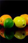 Citrus fruits isolated against a black background