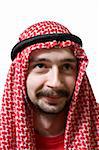 Portrait of smiling arabian young man in traditional headscarf - shemagh.