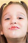 Young girl get gummed with bubble gum