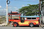 coloful jeepney parked in front of clark air force base in pampanga in the philippines
