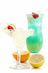 Acoholic Drinks in Margaritas and Hurricane Glass. Strawberry and Lemon Garnish. Isolated on White Background.