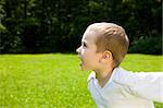 Running Boy Outdoors. Happy Childhood.