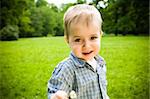 Happy Baby Playing On Field