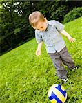 Young Football Player On  The Grass Field