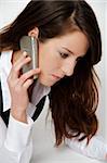Beautiful young woman using a cellphone for business