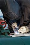 a welder working at shipyard during day shift