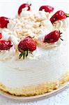 Strawberry meringue cake close up on white background