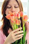 Mature woman holding bouquet of flowers