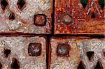 grunge rusty metal frames four corners with rivets, close-up