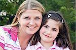 Closeup of Mother and Daughter Smiling