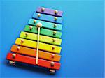 a colorful wooden xylophone over a blue background