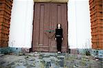 Gothic Style Girl Near A Door