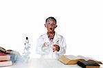 child chemist making smoke from his test tube and beaker