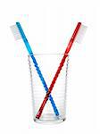 Two toothbrushes in a glass over white background.