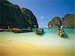 Traditional Thai longtail boats on Maya Bay on Ko Phi-Phi Ley island in Tailand.