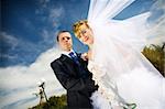 bride and groom in the park