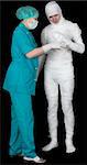 Man in bandage and nurse on black background