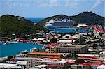 Tropical town - tropical island with a small red-roof town with the background of the large cruise ship. St. Thomas, USVI