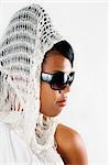 Portrait of young african american woman wearing sunglasses isolated