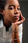 Portrait of young trendy african american teen girl posing with serious expression
