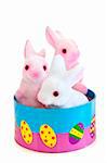 Cute Easter bunny toys in basket isolated on white background