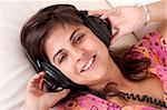 beautiful young girl with headphones listening music