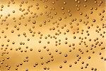 Bubbles in liquid, golden background