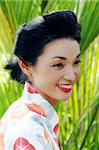 Portrait of a happy Japanese woman dressed in kimono.