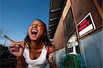 African-American woman in front of rental house