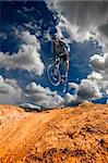 Man mountain biking on trail in outdoors