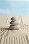 Stone on raked sand. Zen concept.