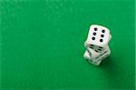 dices. Game cubes on a green background