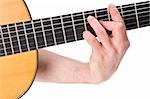 male hand holding a chord on a classsical guitar