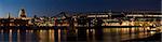 Panoramic picture of St Paul's Cathedral and Millennium Bridge at night.