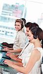 woman smiling at camera in a call centre