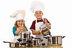 Happy kid chefs making noise banging the cooking pots with wooden spoons - isolated