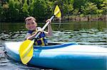 Happy boy kayaking