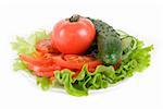 Healthy combination of lettuce, tomato and cucumber on white