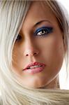 very nice portrait of blond graceful girl with blue make up