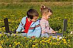 Kids using laptops outdoors in spring time