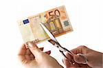 The female hand cuts the banknote with scissors