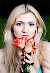 Pretty Girl With Roses. Close-Up Portrait